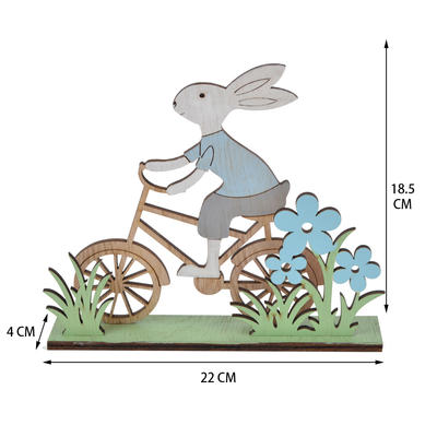 wooden Easter spring bunny rode his bicycle in the grass tabletop decoration