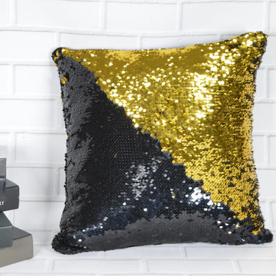 Double-sided gold and black sequined pillows are available as Christmas gifts for home decor